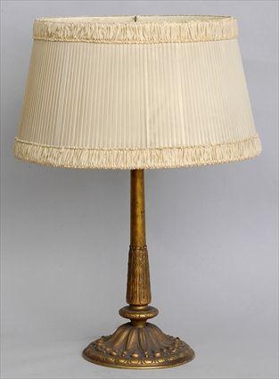 Appraisal: ART NOUVEAU GILT-BRONZE TABLE LAMP The leaf-clad columnar stem on