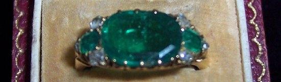 Appraisal: An emerald and diamond ring the stones claw set in