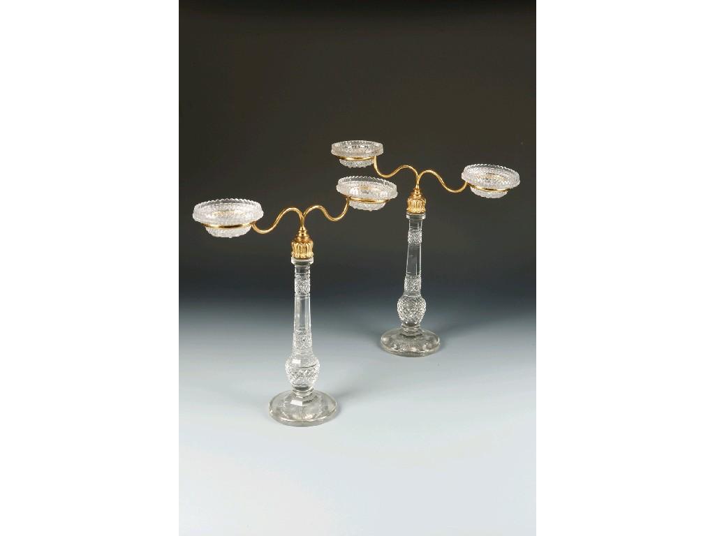 Appraisal: A PAIR OF REGENCY STYLE CLEAR GLASS AND GILT METAL