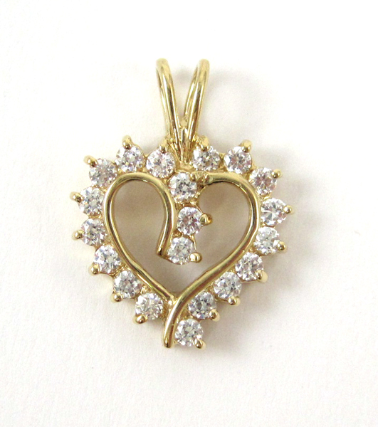 Appraisal: DIAMOND AND TEN KARAT GOLD PENDANT The yellow gold open