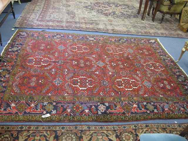 Appraisal: Heriz Persian Handmade Room Size Rug elaborate stylized floral red