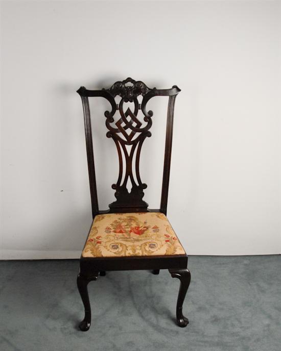 Appraisal: A Chippendale-style Side Chair mahogany with a high back ribbon