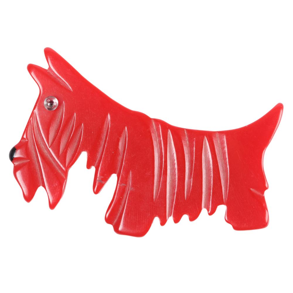 Appraisal: RED BAKELITE HEAVILY CARVED SCOTTIE DOG PIN WITH GLASS EYE