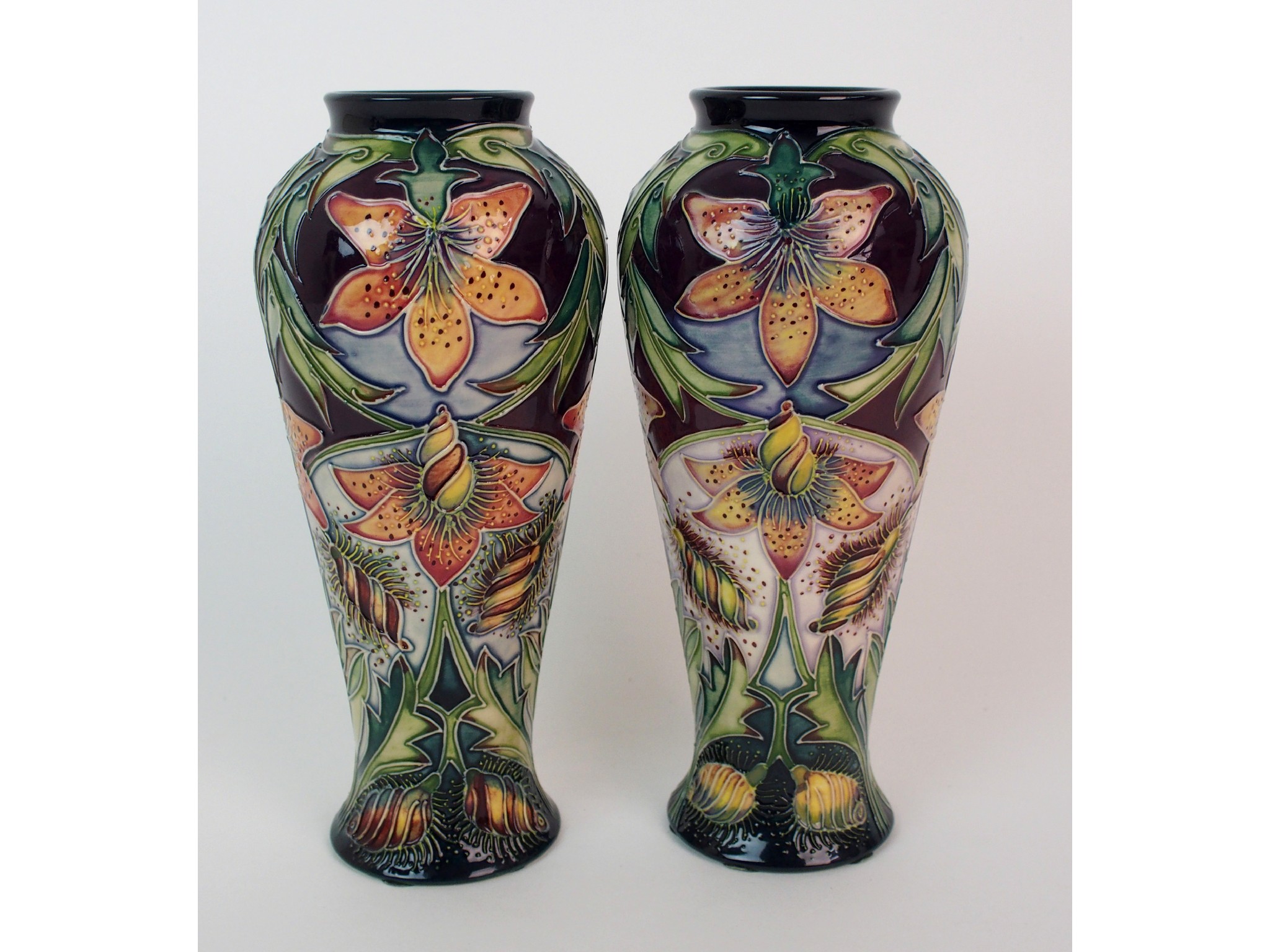 Appraisal: A pair of Moorcroft Pottery Scintilla vases designed by Shirley