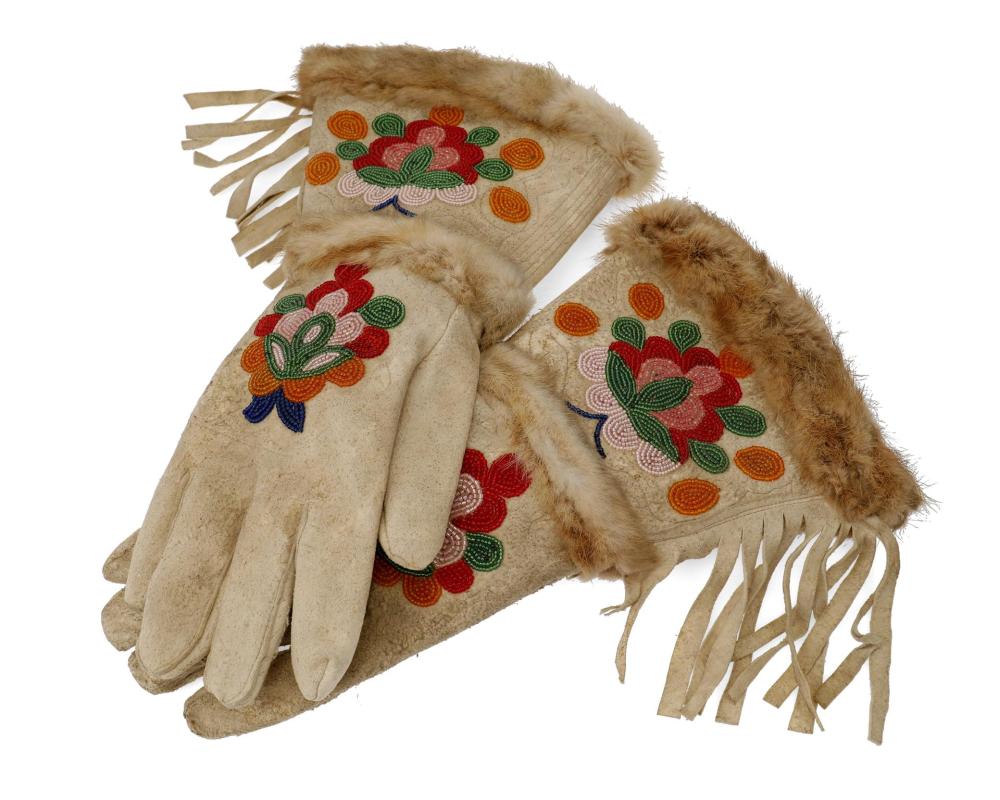 Appraisal: A pair of beaded hide and fur trimmed gauntlets Mid-