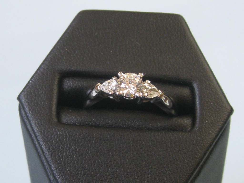 Appraisal: A Diamond three stone Ring the central brilliant-cut stone approx