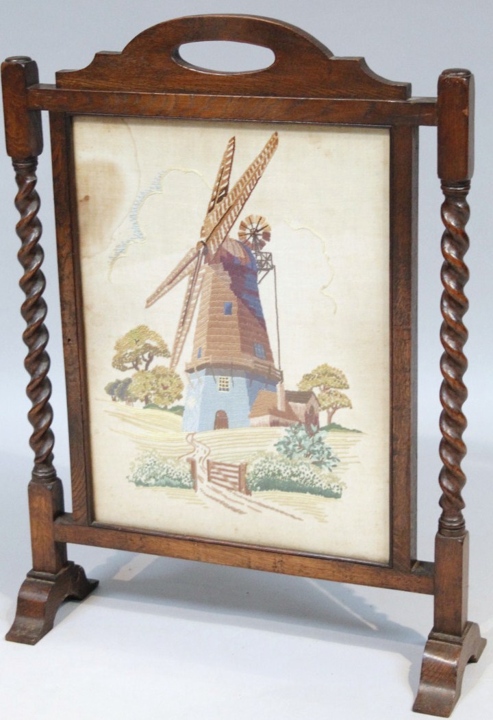 Appraisal: An early thC oak fire screen surmounted by a carrying