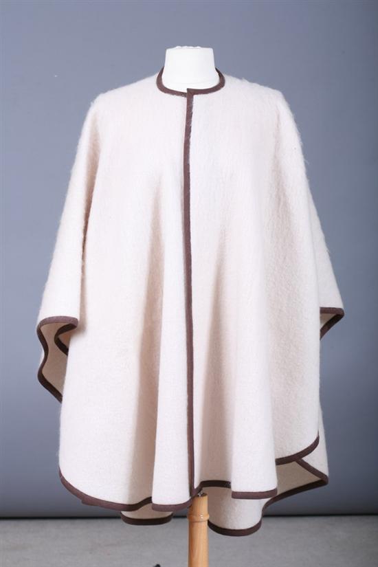 Appraisal: SAINT-LAURENT CREME WOOL CAPE With brown trim PROVENANCE property of