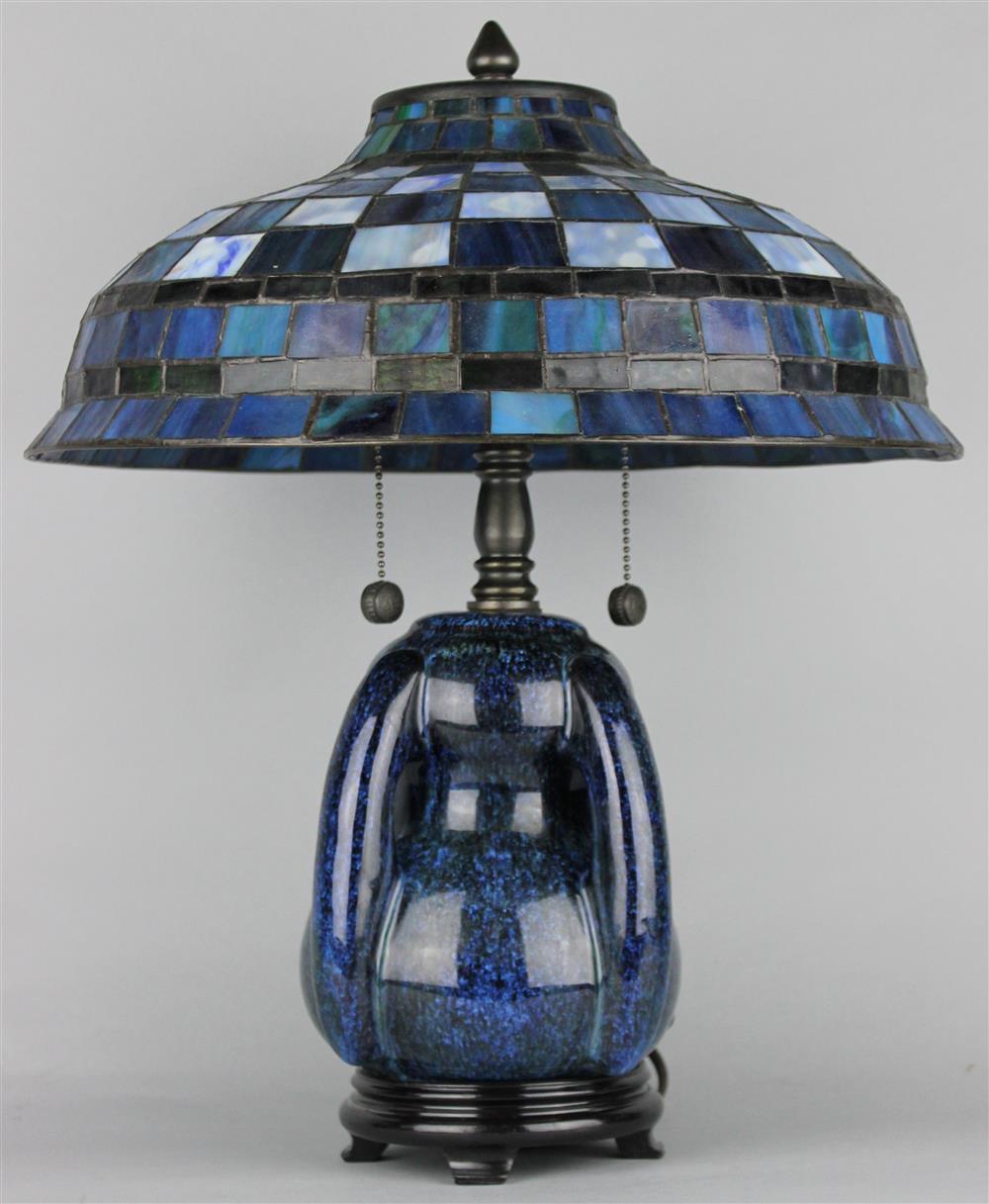 Appraisal: ART POTTERY LAMP WITH BLUE SLAG GLASS SHADE having a