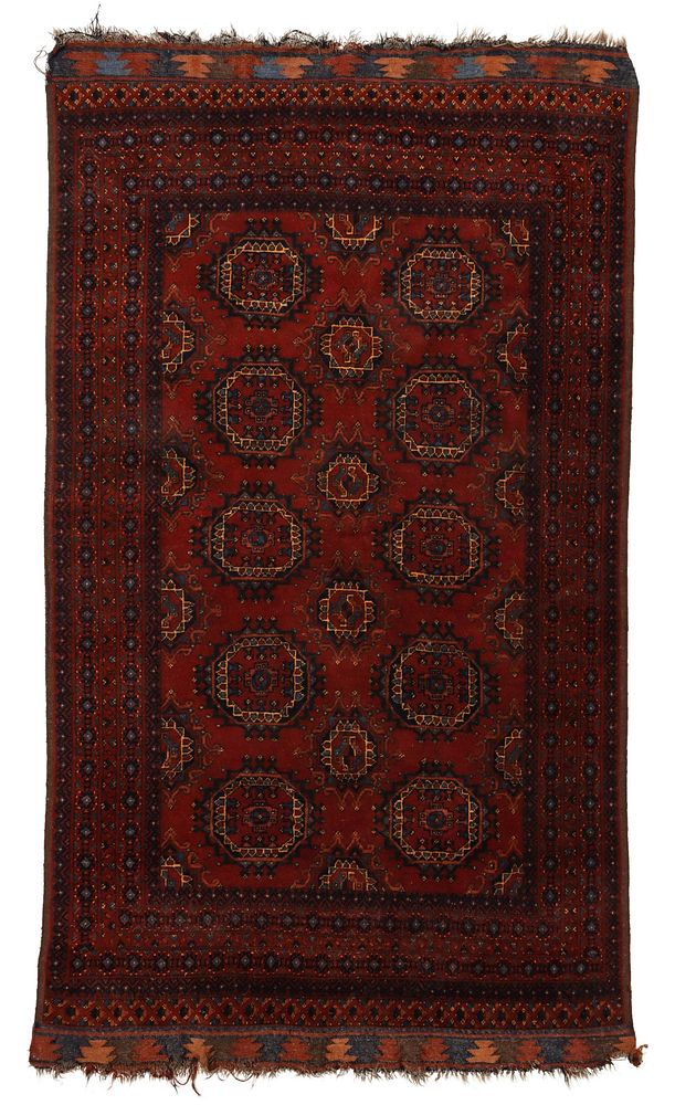 Appraisal: A SEMI-ANTIQUE AFGHAN HAND MADE RUG The darker palette weaving