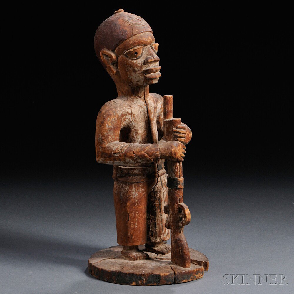 Appraisal: African Carved Wood Colonial Figure Yoruba the standing male form