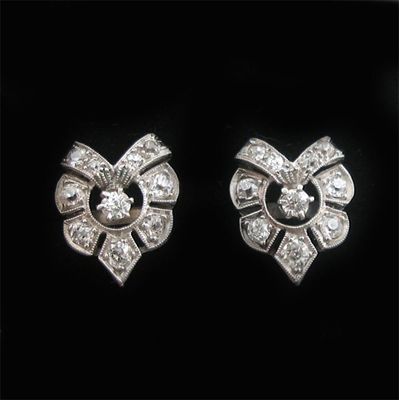 Appraisal: A pair of diamond set openwork ear studs mounted in