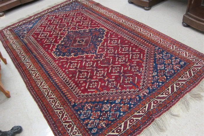 Appraisal: PERSIAN BELOUCHI TRIBAL AREA RUG central floral and blue flower-filled