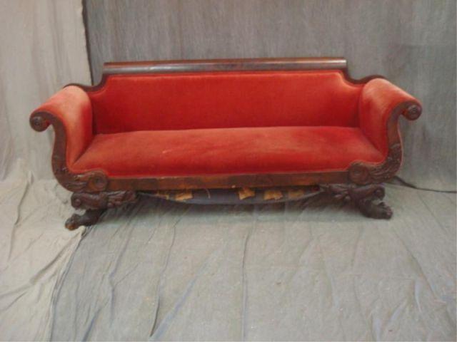 Appraisal: Empire Carved and Claw Foot Mahogany Sofa From a Larchmont