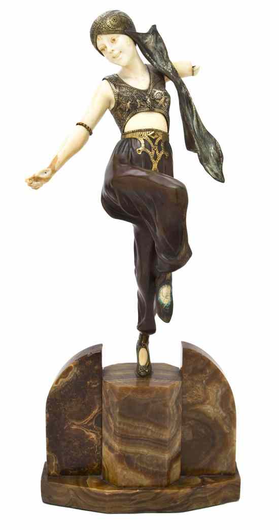 Appraisal: A French Art Deco Patinated Bronze and Ivory Figure Armand