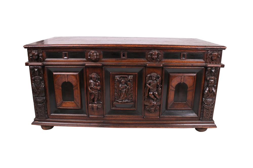 Appraisal: ITALIAN BAROQUE CARVED WALNUT CASSONEthe hinged planked top enclosing an