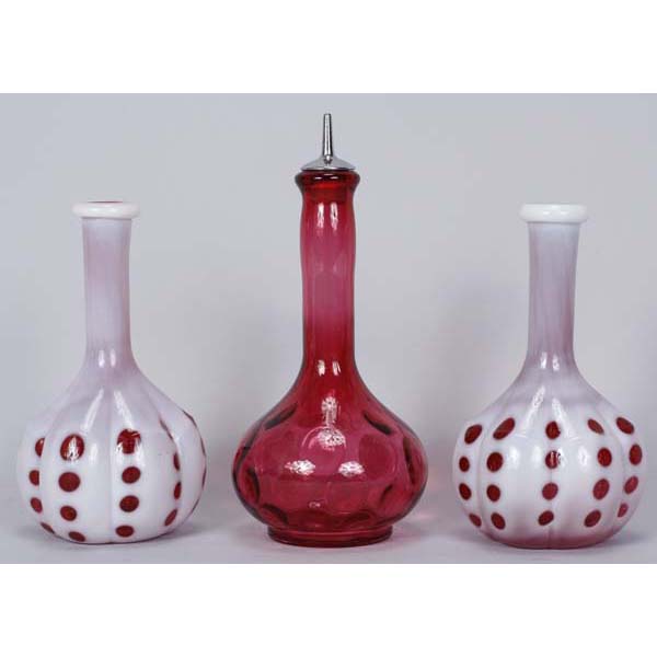 Appraisal: Three cranberry glass barber bottles pair coin dot opalescent melon