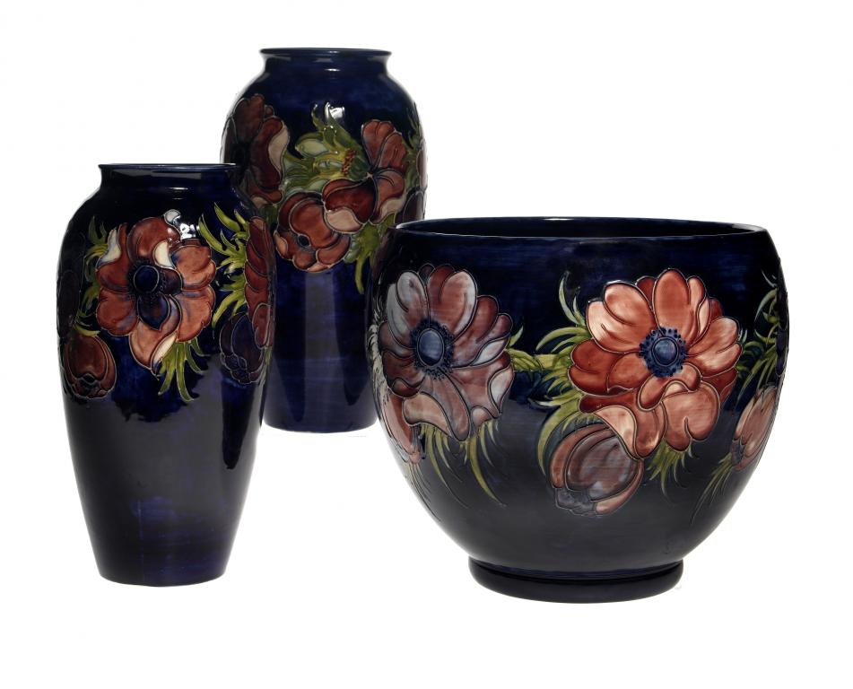 Appraisal: A MOORCROFT ANEMONE JARDINIERE AND PAIR OF VASES DESIGNED BY