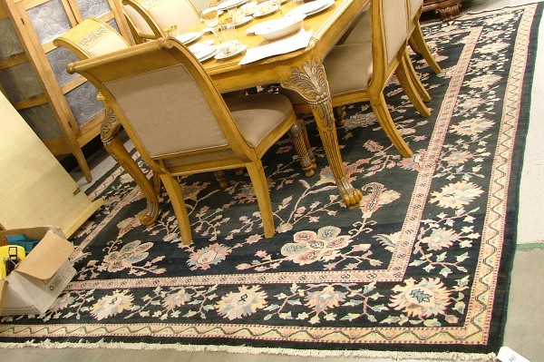 Appraisal: HAND KNOTTED ORIENTAL CARPET Indo-Persian overall floral design on black