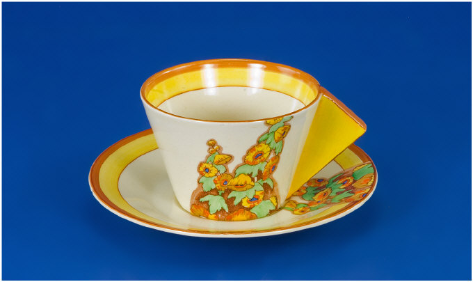 Appraisal: Clarice Cliff Conical Cup and Saucer Circa Sunshine pattern Bizarre