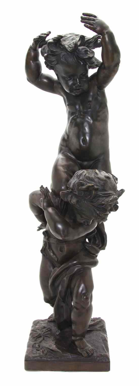 Appraisal: A Continental Bronze Figural Group depicting two putti one atop