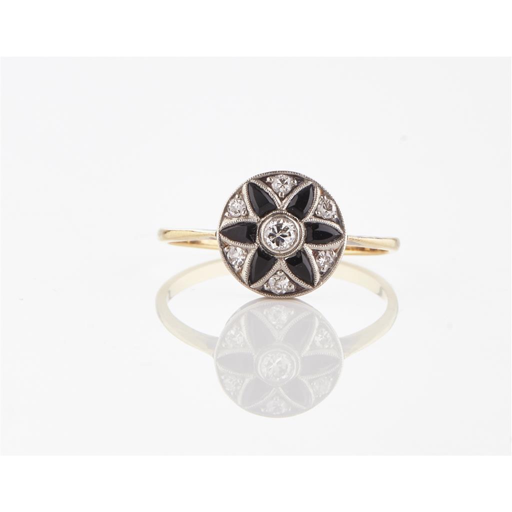 Appraisal: An onyx and diamond set cluster ring collet set to