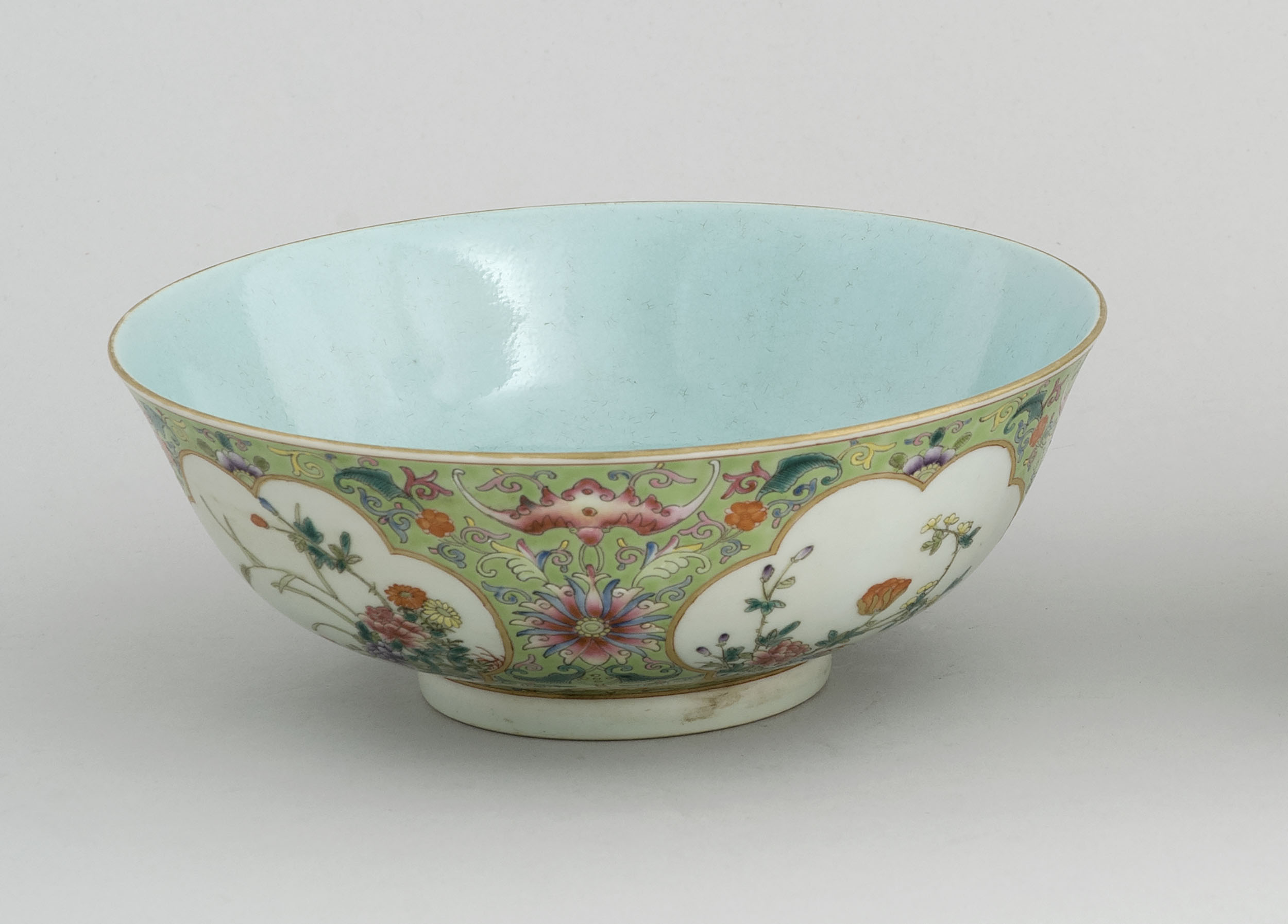 Appraisal: POLYCHROME PORCELAIN BOWL th CenturyWith floral cartouches on a green