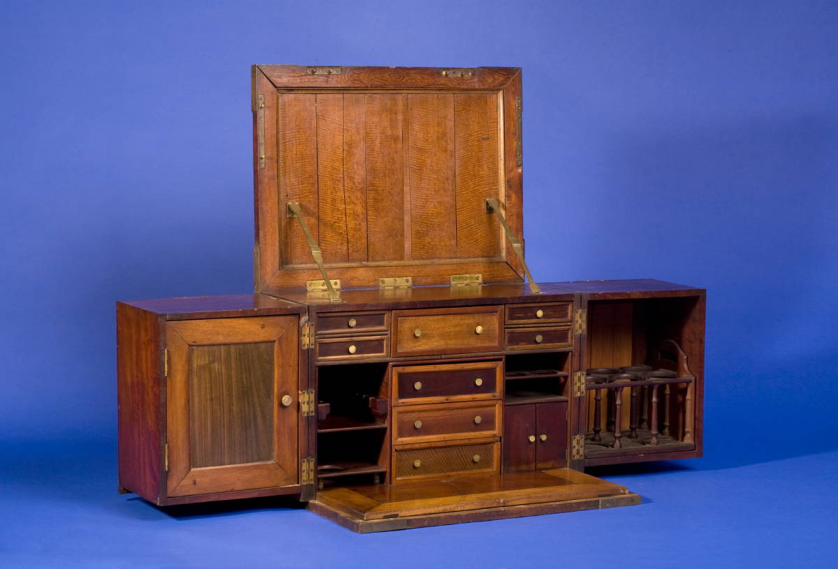 Appraisal: BRASS-BOUND INLAID HARDWOOD CAMPAIGN LIQUOR CABINET The rectangular hinged top