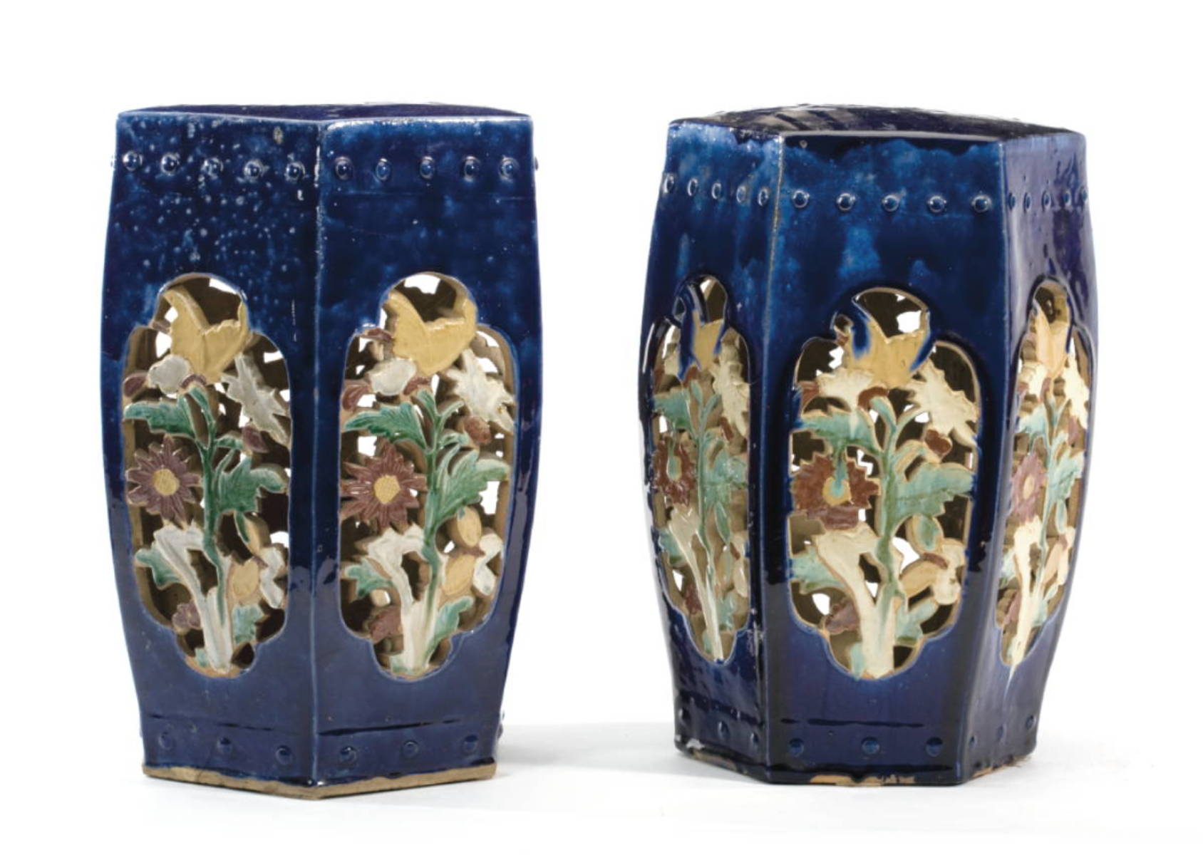 Appraisal: PAIR OF BLUE-GLAZED AND FLORAL DECORATED HEXAGONAL GARDEN SEATS Height