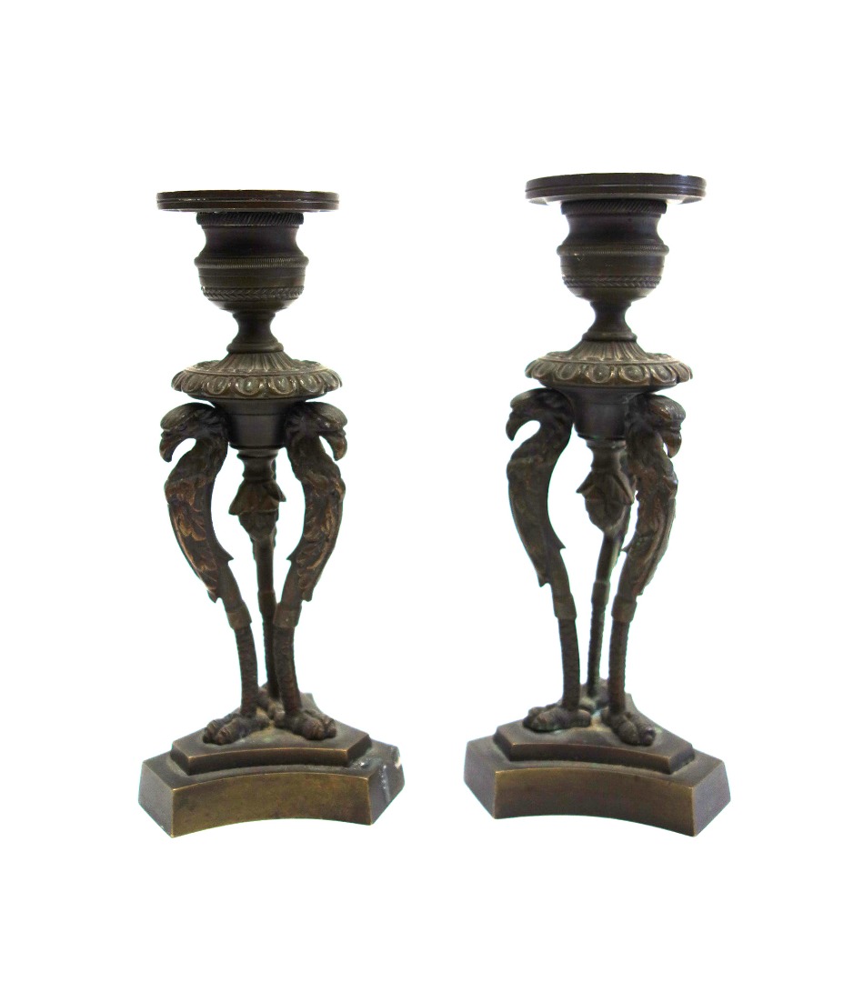 Appraisal: A pair of Empire gilt metal candlesticks the vase shape