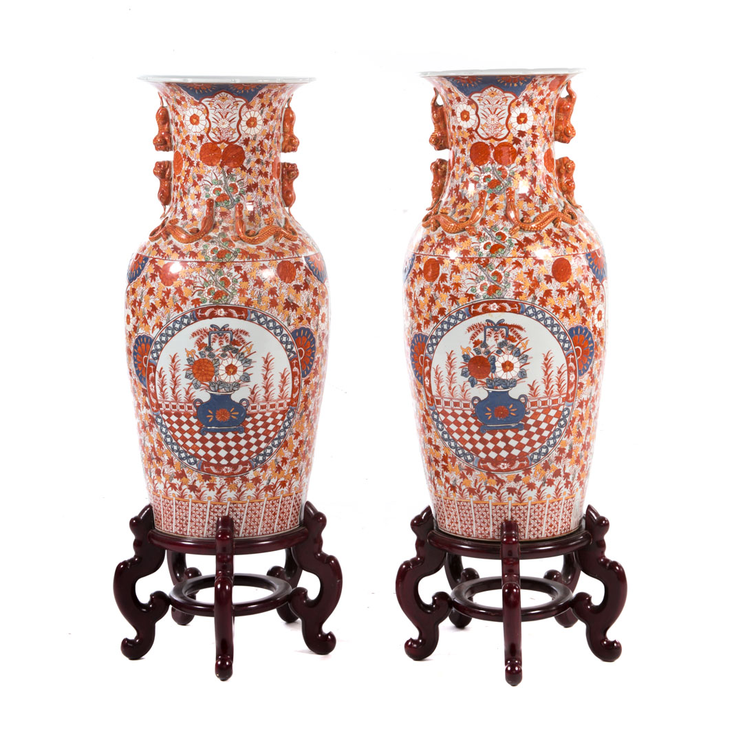 Appraisal: Pair Japanese Imari porcelain palace vases th century with wooden