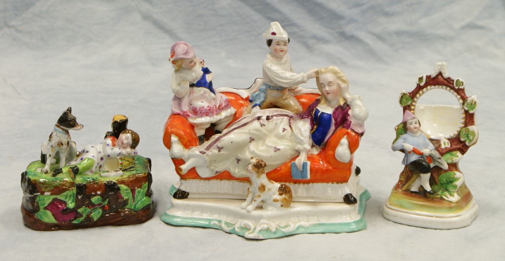 Appraisal: Continental porcelain figural covered inkwells largest l h with a