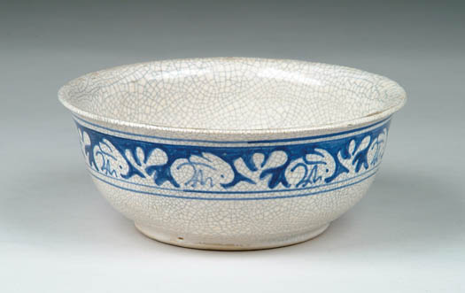 Appraisal: DEDHAM POTTERY FOOTED BOWL WITH RABBIT DECORATION Blue and white