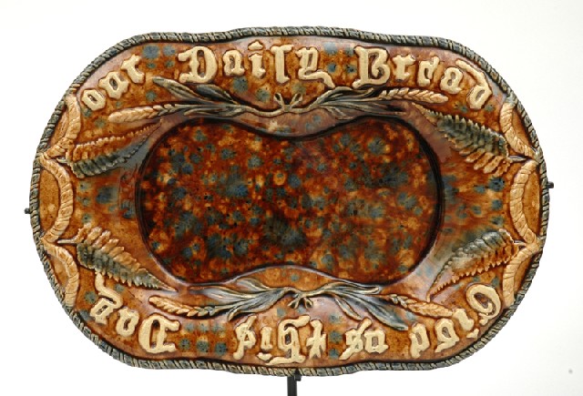 Appraisal: AN AUSTRALIAN POTTERY BREAD PLATE Victoria Circa Rounded rectangular earthenware