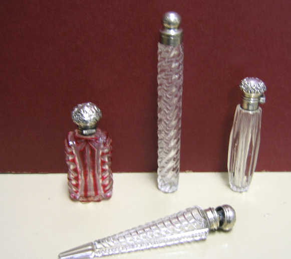 Appraisal: FOUR VICTORIAN CUT GLASS SCENT BOTTLES Each with inner stopper