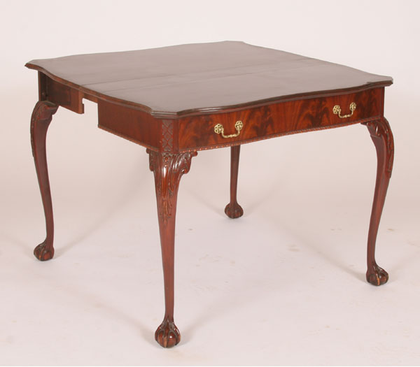 Appraisal: Mahogany game table claw and ball feet carved knees carved