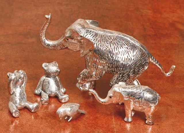 Appraisal: TWO MINIATURE SILVER SEATED TEDDY BEARS high two silver plated