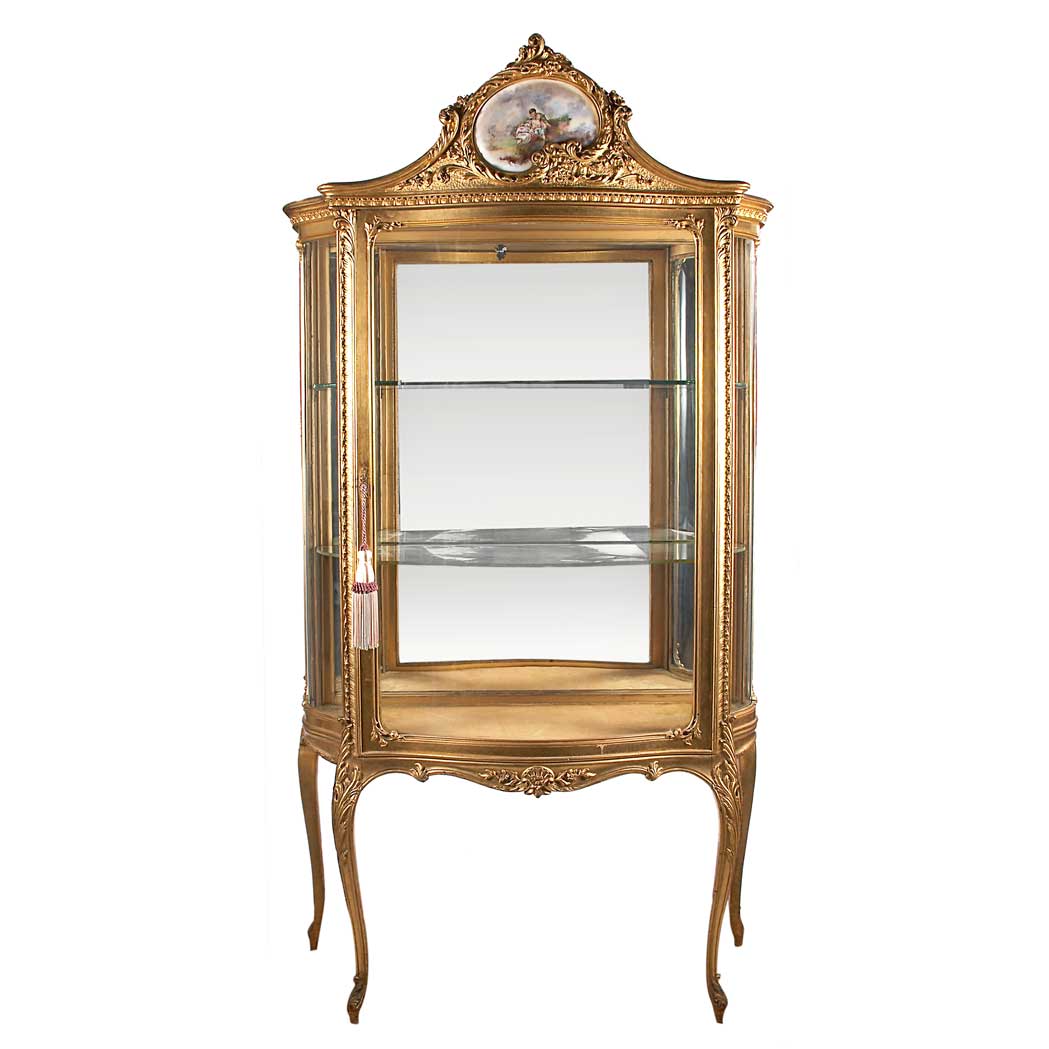 Appraisal: Louis XV Style Gilt-Wood Mirrored Vitrine The serpentine-shape top surmounted