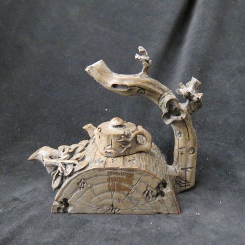 Appraisal: Oriental Figural Teapot log branch motif small teapot as finial