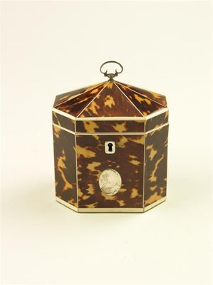 Appraisal: A George III tortoiseshell and ivory strung octagonal tea caddy