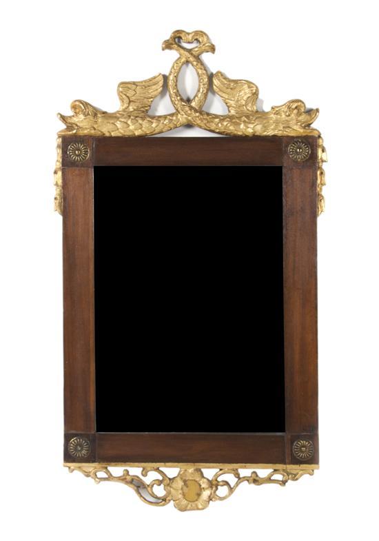 Appraisal: n Empire Style Mahogany Parcel Gilt Mirror the crest with