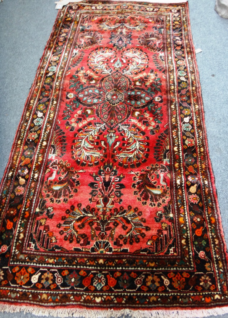 Appraisal: A Sarough rug Persian the madder field with a central