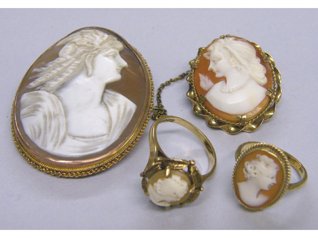 Appraisal: Two gold mounted carved cameo brooches and two ct cameo