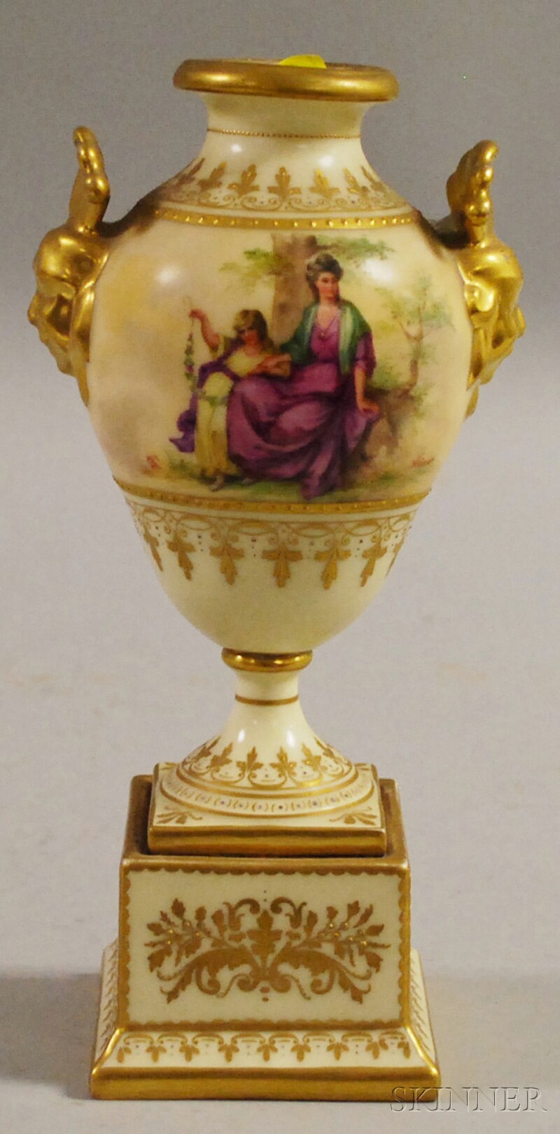 Appraisal: Austria Gilt and Hand-painted Porcelain Urn depicting cherubs and Lady