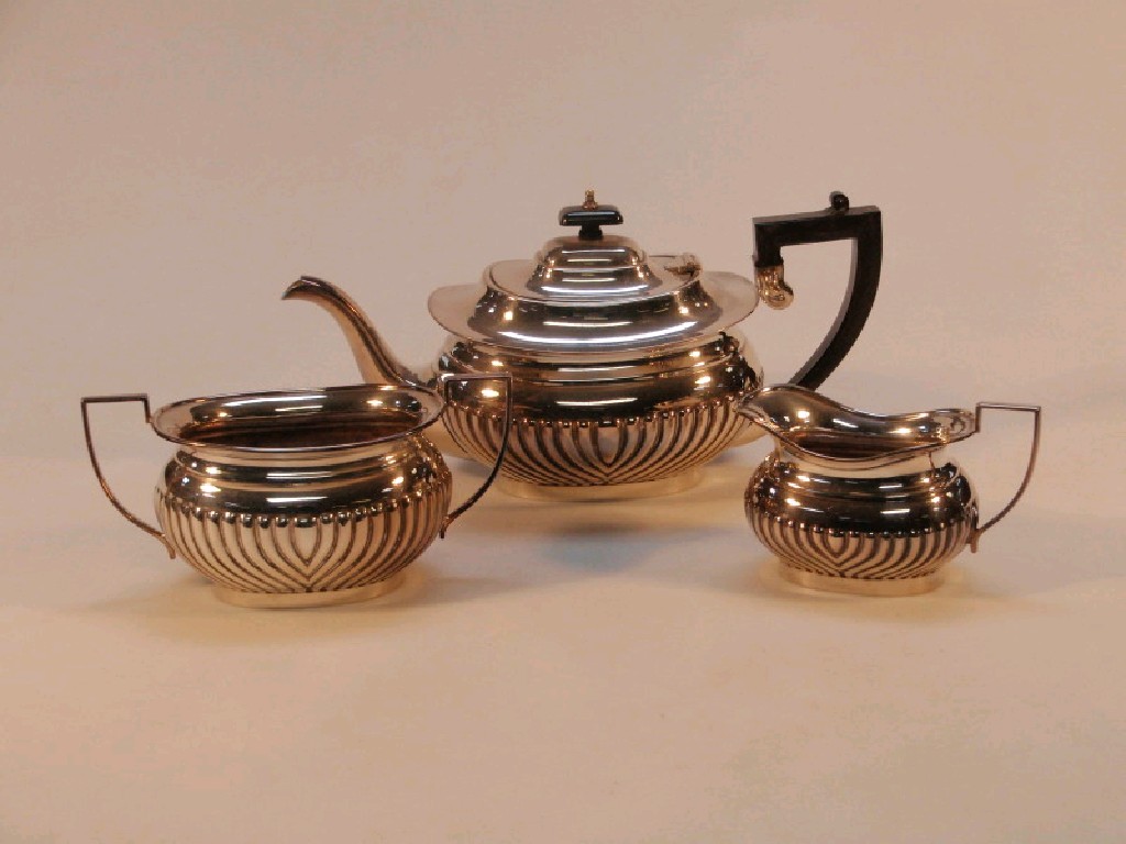 Appraisal: An EPNS three piece tea service of oval lobed design