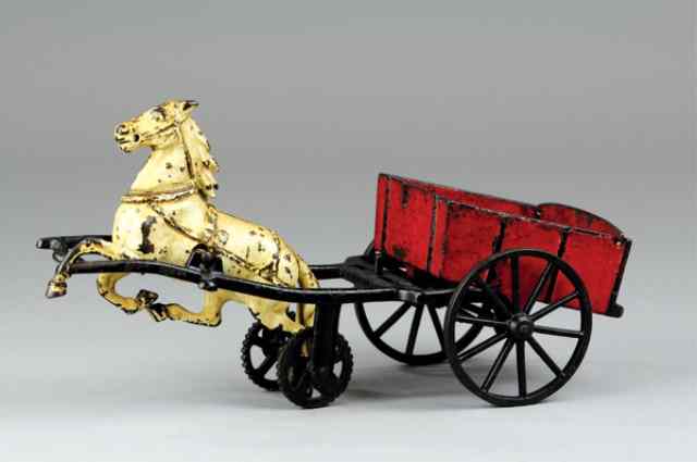 Appraisal: CARPENTER COAL WAGON Horse drawn cast iron red open wagon