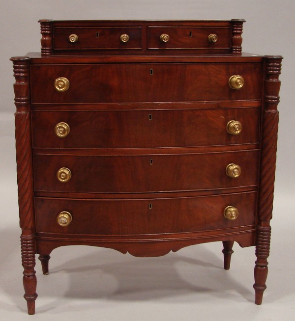 Appraisal: Mahogany bow front four drawer chest topped with a conforming