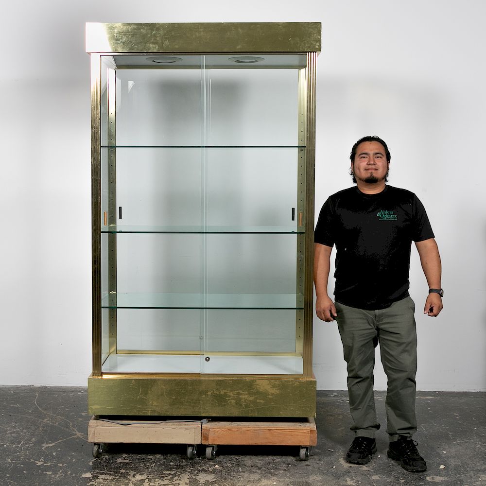 Appraisal: Brass Glass Display Cabinet A brass glass display cabinet with