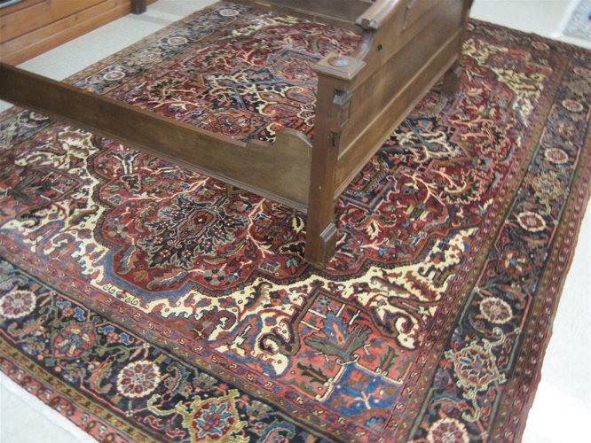 Appraisal: SEMI-ANTIQUE PERSIAN HERIZ CARPET East Azerbaijan Province northwestern Iran floral