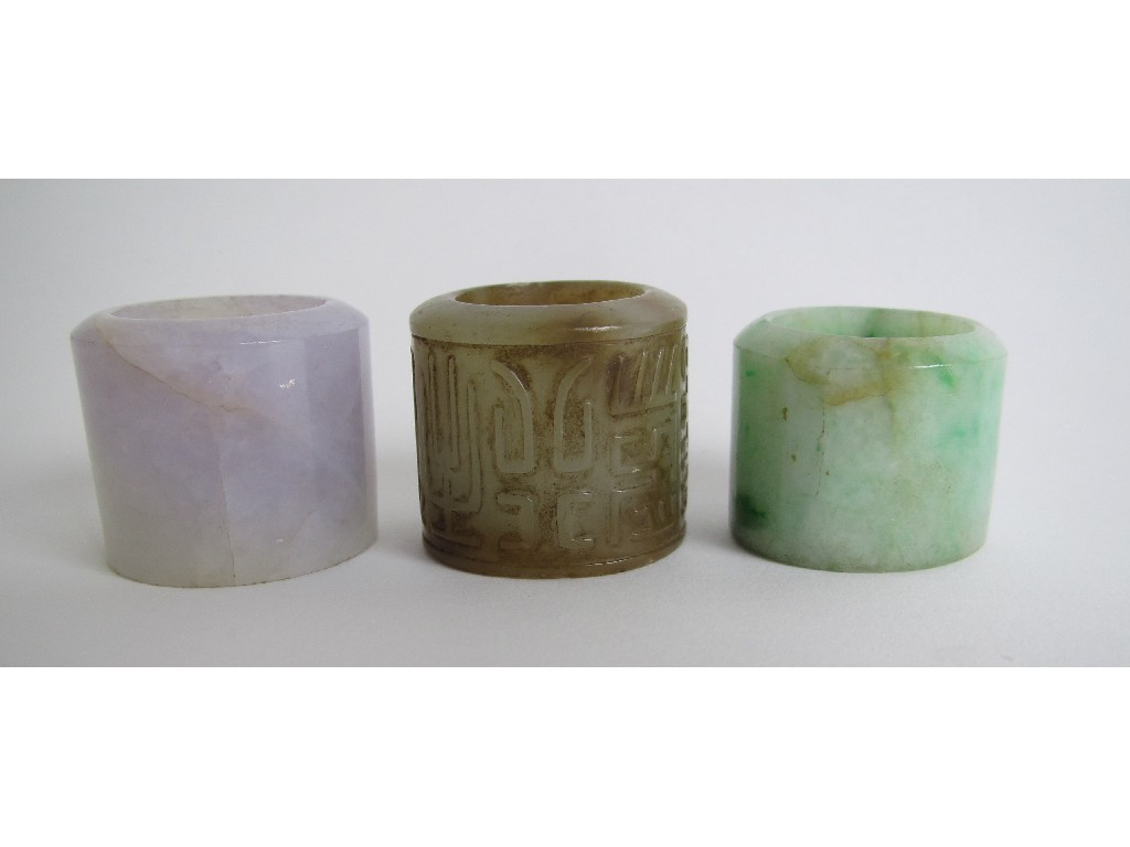 Appraisal: Three Chinese jade archers rings one with calligraphy another lavender